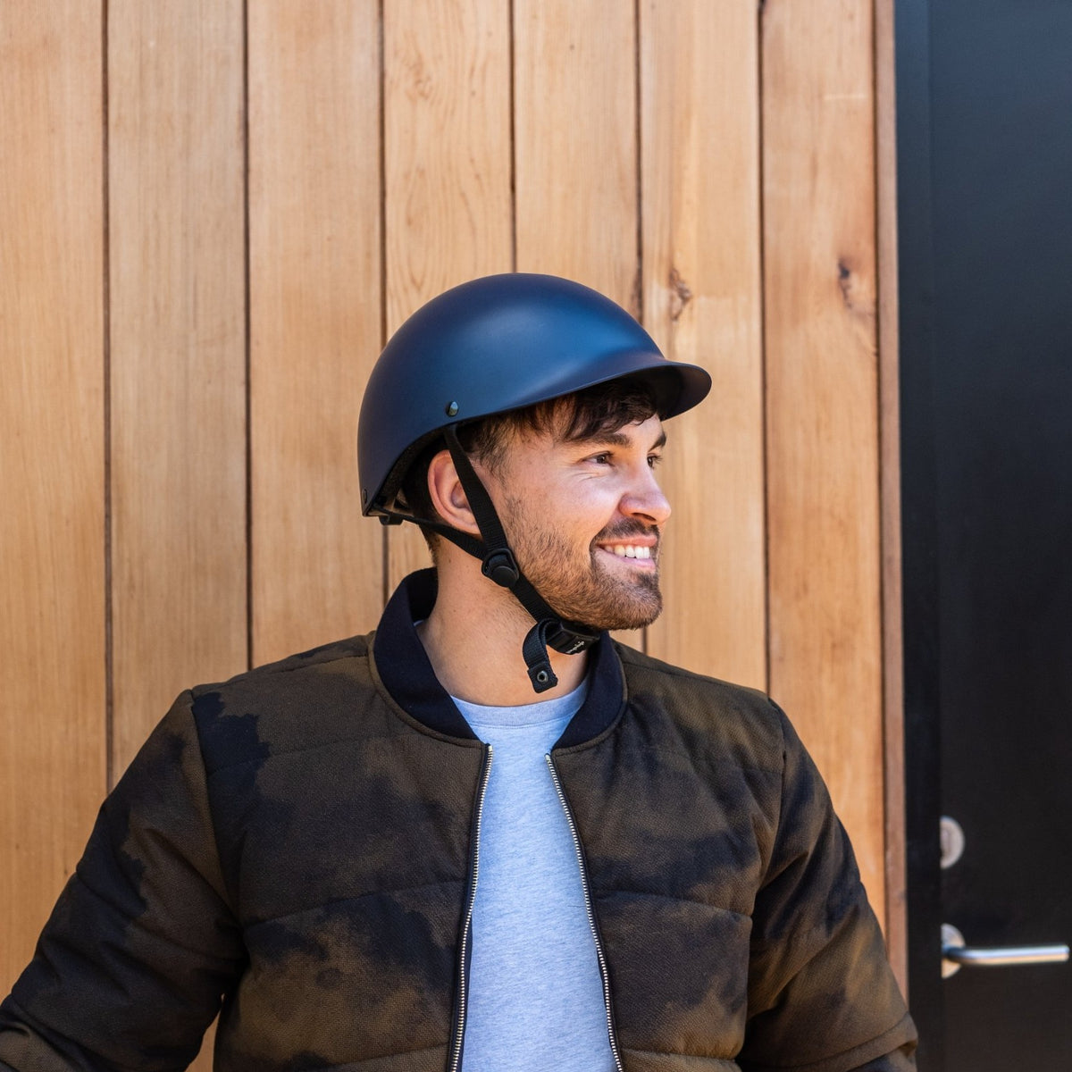 Smiling man wearing a Dashel ReCycle Navy Blue bike helmet