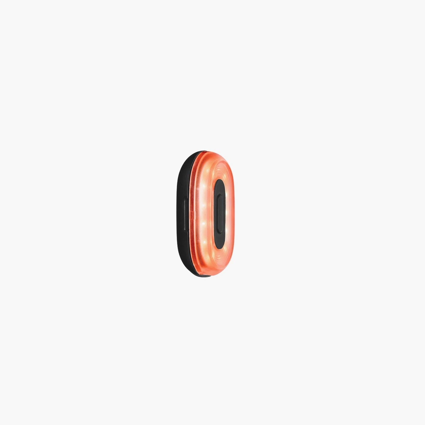Side view of Beryl Pixel rechargeable LED bike light illuminated in red with waterproof compact design